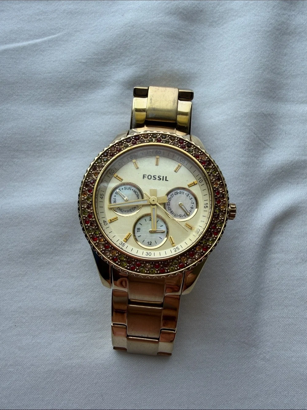 Fossil Women’s Gold-Tone Multi-Function Crystal Bezel Watch